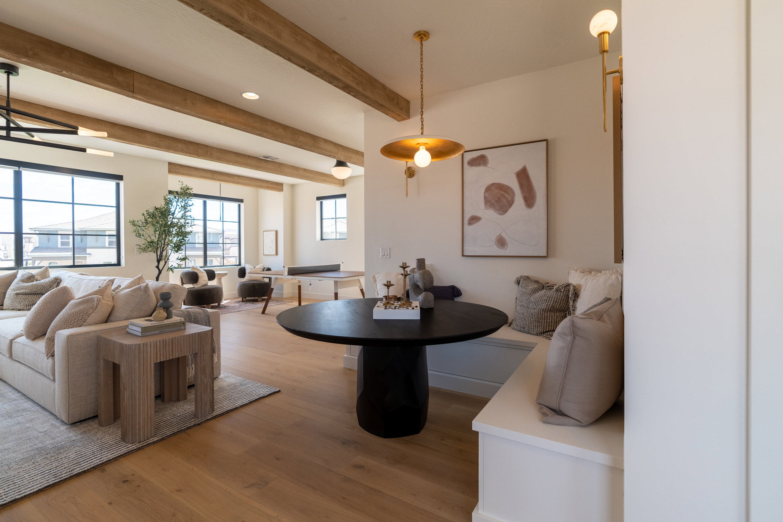 Dining room with healthy amount of natural light, light wood finished floors, beam ceiling, and recessed lighting