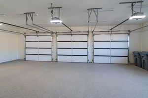 Garage featuring a garage door opener