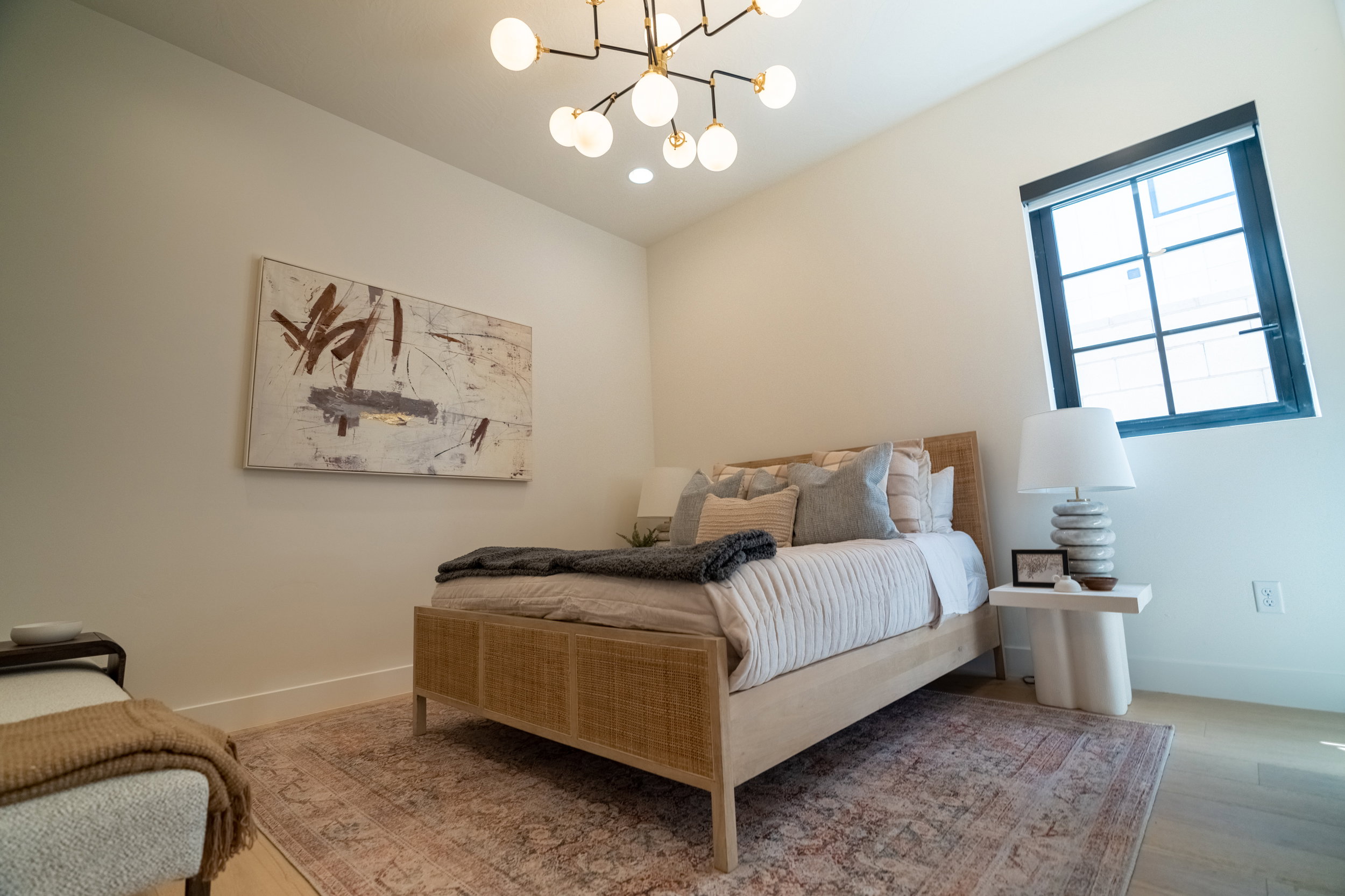 Bedroom with a chandelier and light wood-style flooring