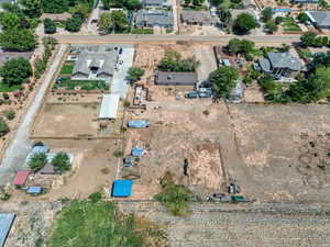 Aerial view of property's location with nearby suburban area