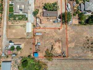 Aerial view of property and surrounding area featuring property boundaries highlighted