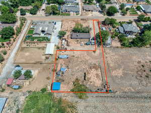 Aerial view of residential area with property parcel outlined