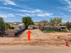 View of community with a mountain view and driveway