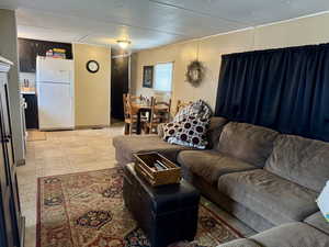 Living area featuring light tile patterned floors