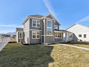 View of front of property with roof with shingles, board and batten siding, and a mountain view