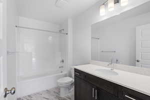 Full bathroom featuring vanity, shower / tub combination, and light wood-type flooring