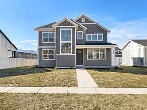 View of front of property featuring covered porch and board and batten siding