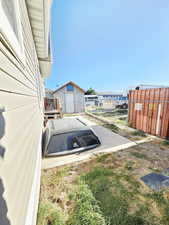 View of yard featuring an outbuilding and a patio