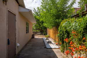 View of side of property with a patio area