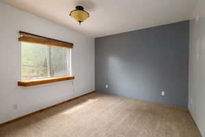Unfurnished room with carpet flooring