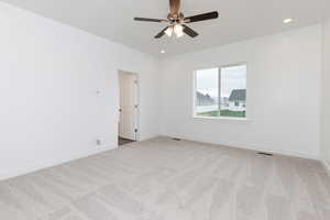 Unfurnished room with light carpet, recessed lighting, and ceiling fan