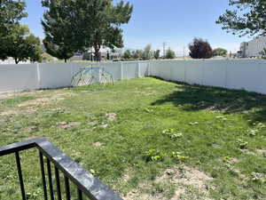 View of fenced backyard