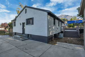 View of side of property featuring a mountain view