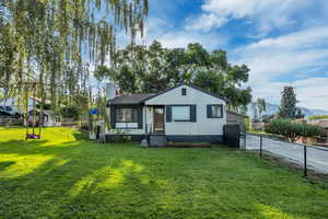 Bungalow featuring a chimney