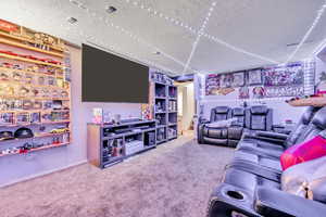 Living area with carpet floors and baseboards