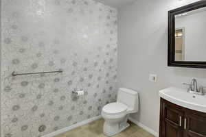 Half bath featuring vanity and toilet