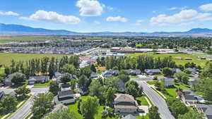 Aerial view of residential area featuring a mountainous background