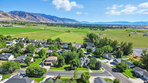 Aerial view of sparsely populated area with a mountain backdrop