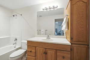 Full bathroom with bathing tub / shower combination and vanity