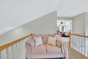 Living room with carpet flooring and recessed lighting