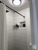 Full bathroom with a tile shower