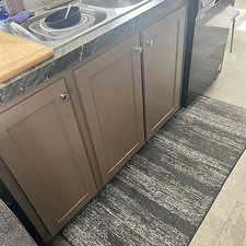 Kitchen view of gray cabinets