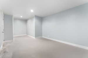 Unfurnished room featuring concrete flooring and recessed lighting