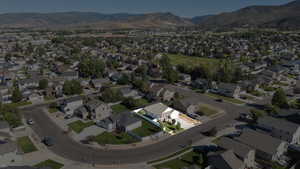 Aerial view of property's location with nearby suburban area