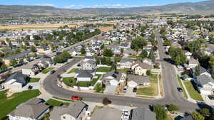 Aerial overview of property's location with nearby suburban area