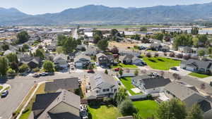 Aerial view of residential area featuring a mountainous background