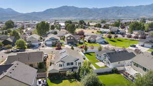 Aerial perspective of suburban area featuring a mountainous background