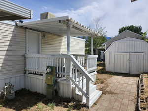 Doorway to property featuring a deck