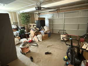 Garage featuring a garage door opener