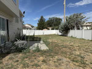 Fenced backyard featuring a patio area