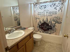 Bathroom featuring shower / tub combo and vanity