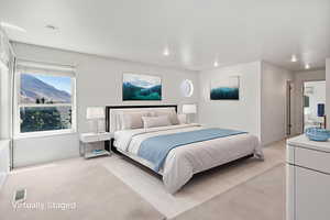 Bedroom with light carpet and recessed lighting