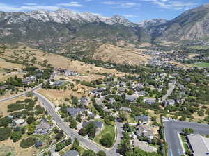 View of property location with a mountain backdrop and nearby suburban area