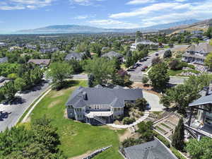 Aerial perspective of suburban area with a mountain backdrop