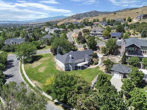 Aerial perspective of suburban area with a mountain backdrop