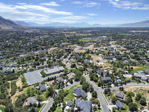Aerial perspective of suburban area with a mountainous background
