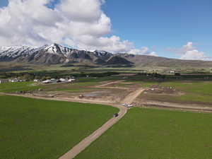View of mountain backdrop with rural landscape