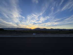 View of mountain backdrop with rural landscape