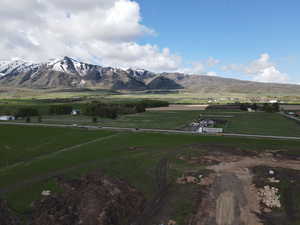 View of mountain background featuring rural landscape and large plots for crops