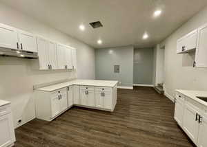 Washroom featuring dark wood finished floors and recessed lighting