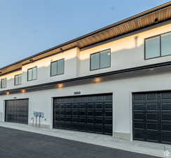 View of building exterior featuring a garage