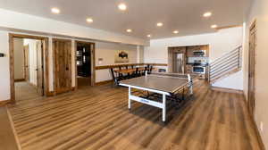 Playroom with recessed lighting and wood finished floors