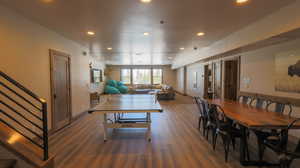 Dining space featuring stairs, recessed lighting, and wood finished floors