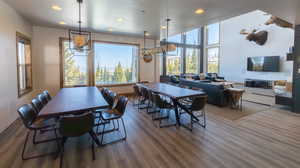 Dining area featuring wood finished floors and recessed lighting