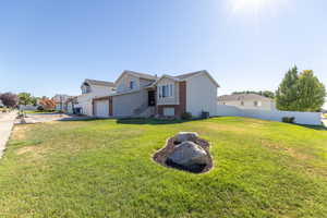 View of home's exterior featuring driveway and a garage