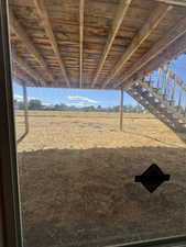 View of yard with a view of rural / pastoral area and stairway